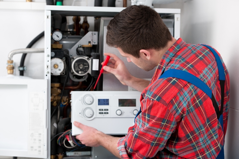Gas Safe engineer working on a boiler in Camden Town