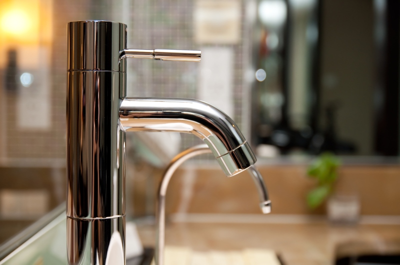 Leaking tap being repaired in Camden Town